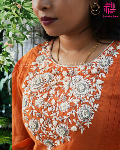 Orange Mul Chanderi Suit with Embroidered Yoke & Pintuck Sleeve Details | Threads & Twirls