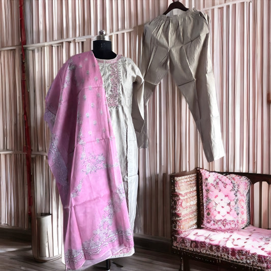 Silver Grey Roman Silk Salwar Suit with Contrast Pink Floral Dupatta & Embroidered Yoke