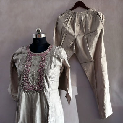 Silver Grey Roman Silk Salwar Suit with Contrast Pink Floral Dupatta & Embroidered Yoke